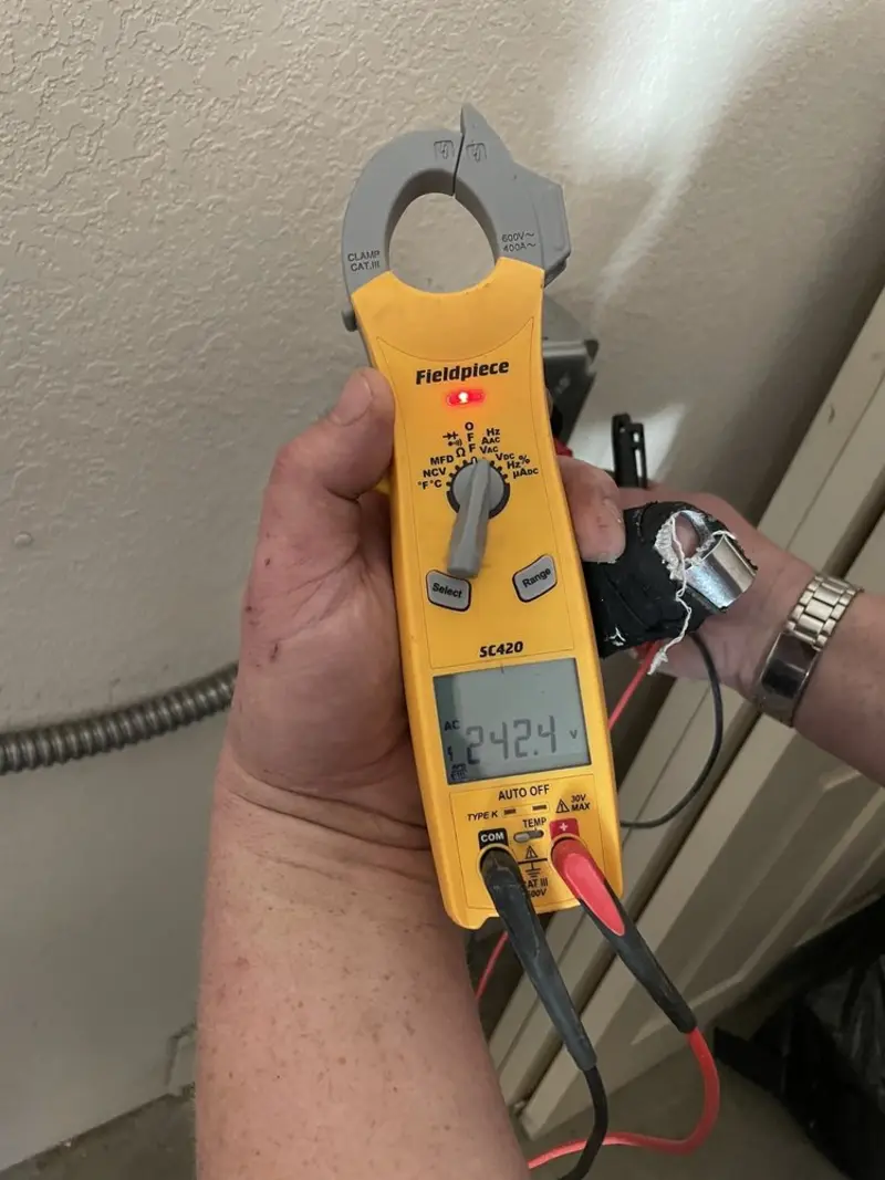 Voltage testing with clamp meter during Aluminum Wiring Replacement in Bondurant